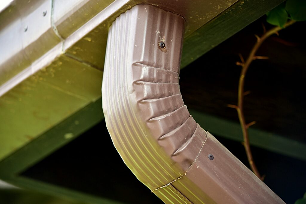 Rain gutter and downspout.